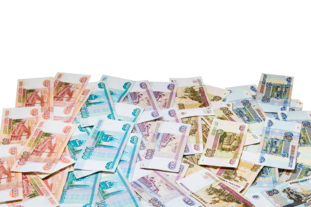 istock Lots of money isolated on white 1002218936