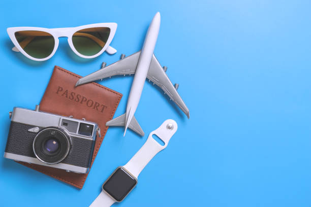istock Travel blogger accessories on blue copy space 1002230786