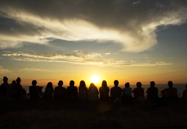 Group of people looking at sunset view