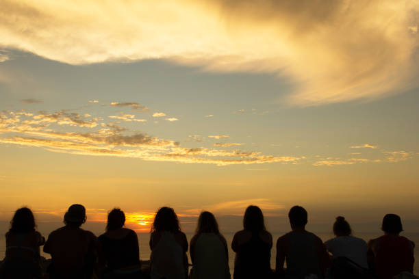 istock Friends Watching Sunset from Mountain 1002243838
