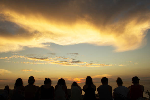 istock Silhouette of Friends Watching Sunset 1002243910