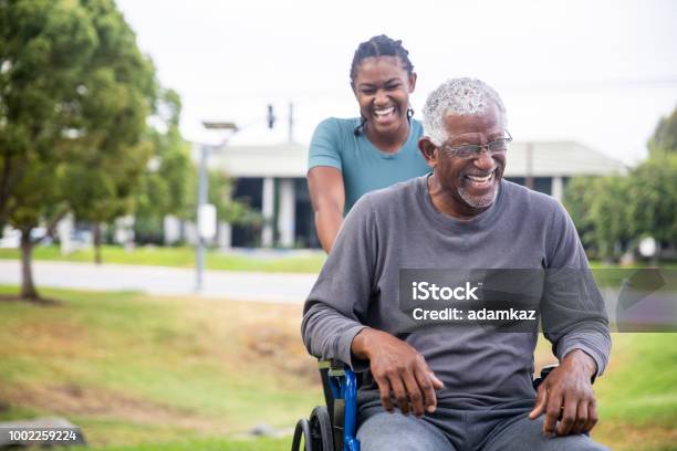 Senior Black Man In Wheelchair With Daughter Stock Photo - Download Image Now - Senior Adult, African-American Ethnicity, Wheelchair