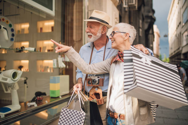 istock Old people looking at the store window 1002259340
