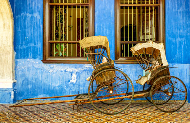 istock Chinese rickshaw on display in front of the building 1002260496