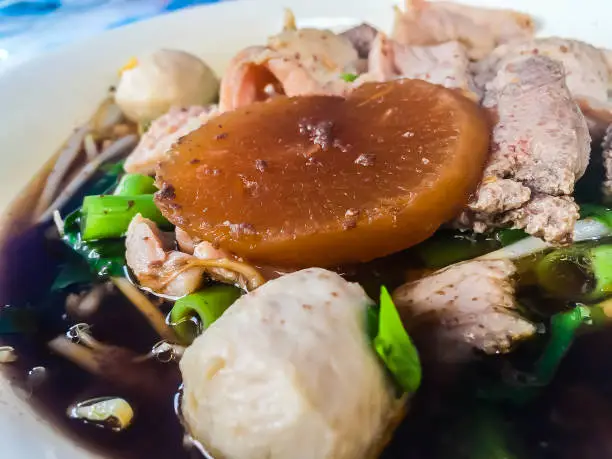 Photo of Noodles with pork and pork balls soup, one of the popular Thai street food menus. Don't miss when you visit Thailand.