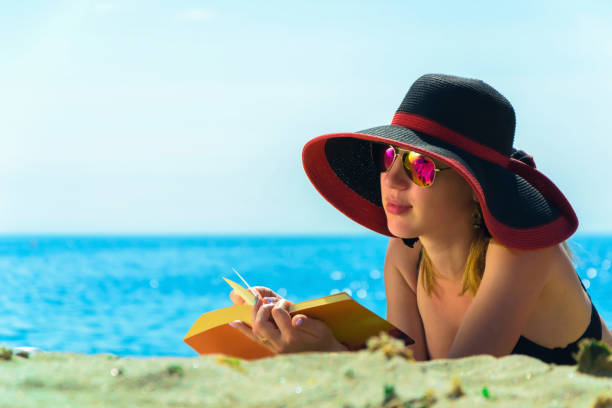 istock Young caucasian woman on a beach 1002263522