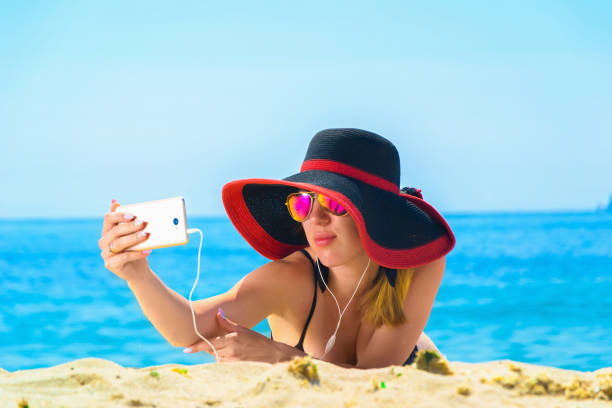 istock Young caucasian woman on a beach 1002263636