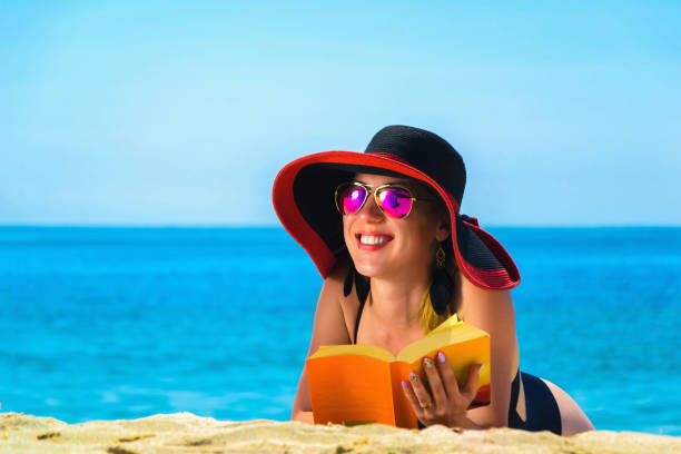 istock Young caucasian woman on a beach 1002263672