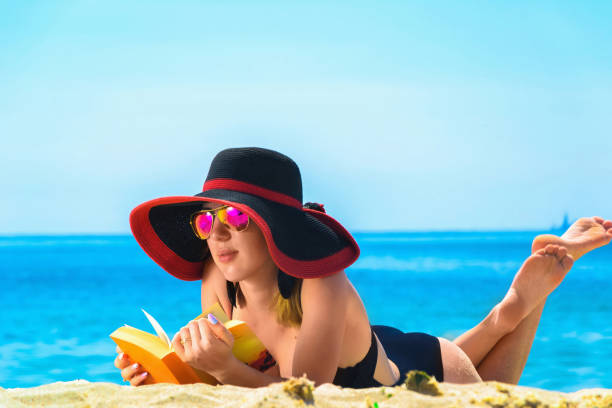 istock Young caucasian woman on a beach 1002263686