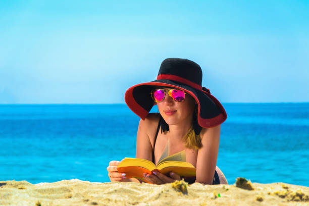 istock Young caucasian woman on a beach 1002263772