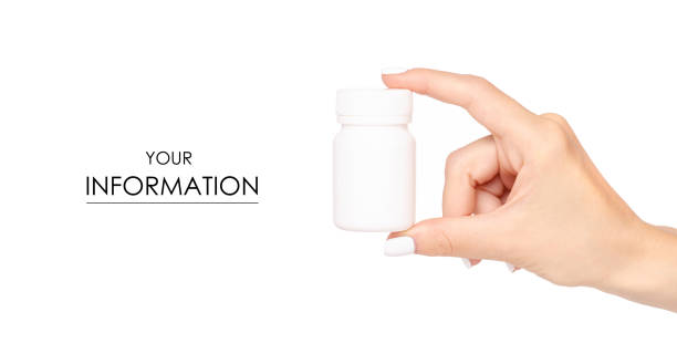 istock White jar of pills in hand pattern 1002264536