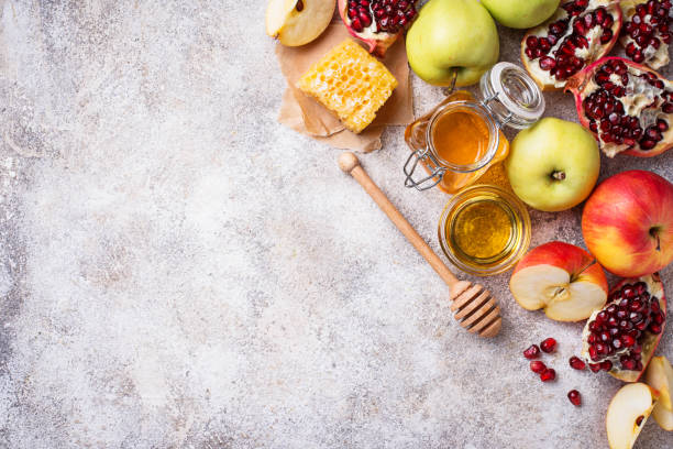 istock Honey, apple and pomegranate for Rosh Hashana 1002264612