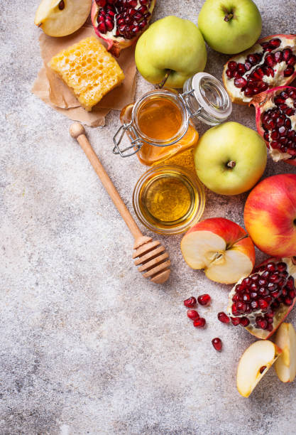 istock Honey, apple and pomegranate for Rosh Hashana 1002265020