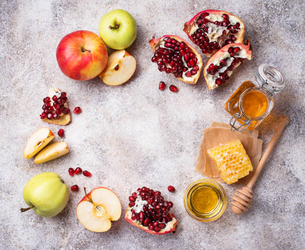 istock Honey, apple and pomegranate for Rosh Hashana 1002265520