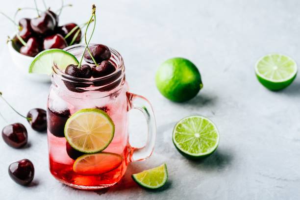 istock Cherry Limeade or Lemonade in glass mason jar. Ice cold summer drink. 1002275036