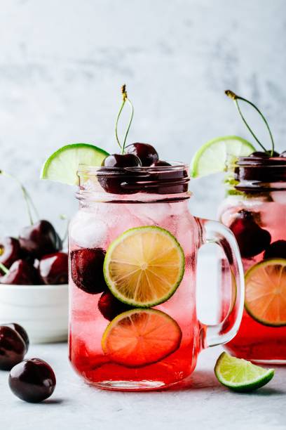 istock Cherry Limeade or Lemonade in glass mason jar. Ice cold summer drink. 1002275062