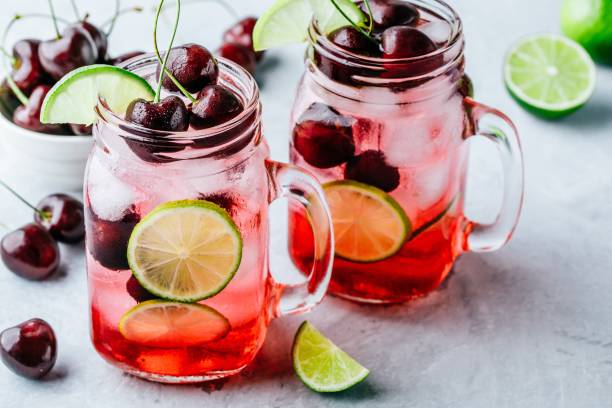istock Cherry Limeade or Lemonade in glass mason jar. Ice cold summer drink. 1002275094