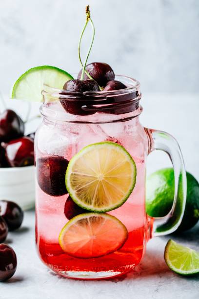 istock Cherry Limeade or Lemonade in glass mason jar. Ice cold summer drink. 1002275102