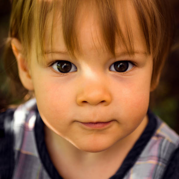 istock little girl portrait 1002281142