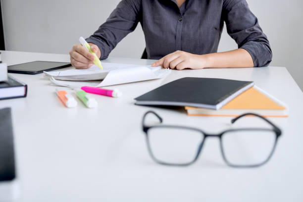istock Images of studying student hands writing in book during lecture education students college of university, Reading, Learning, technology and Exam. Education concept 1002283954