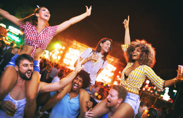 istock Friends dancing at a concert. 1002284484