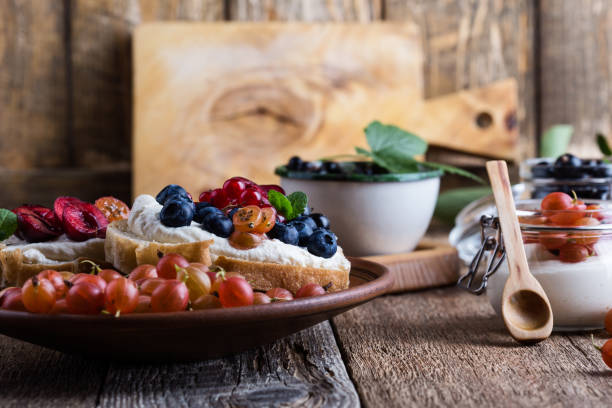 istock Cream cheese sandwiches with fresh summer berries 1002294696