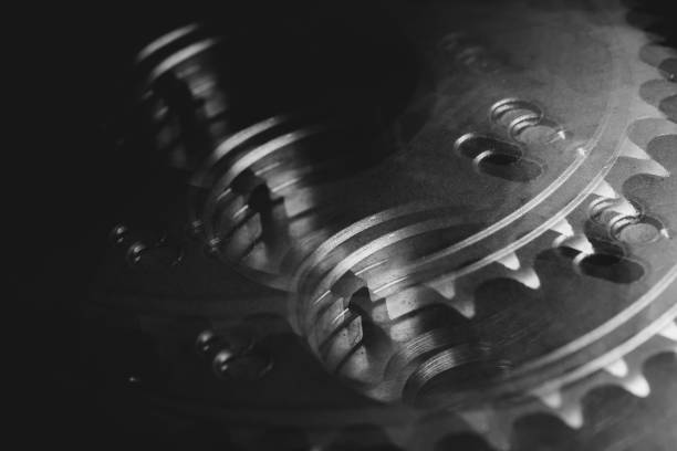 istock Monochrome multi exposition background of gear close up. Artwork from auto part in macro photography. 1002295098