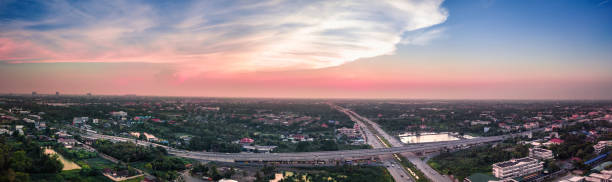 istock High Angle View Of Illuminated City Against Sky During Sunset 1002295154