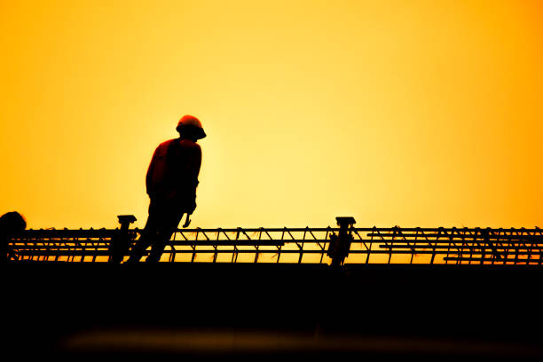 Engineers are consulting before ordering construction work on site. Construction teams are working in heavy industries, ground and safety concepts.