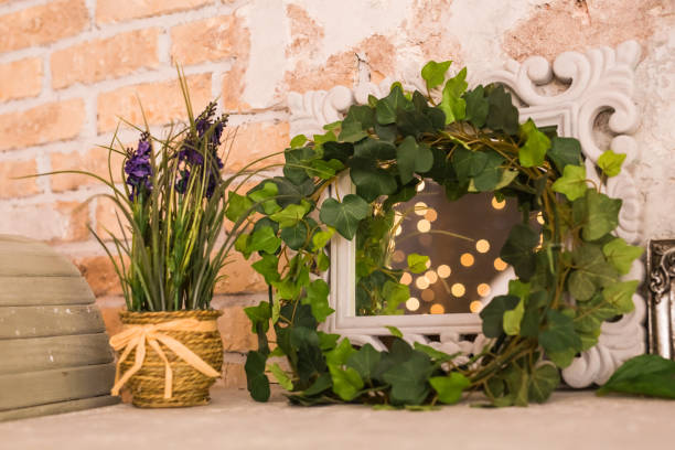 istock vintage wooden rectangular white frame with green plant. Floral scene 1002304524