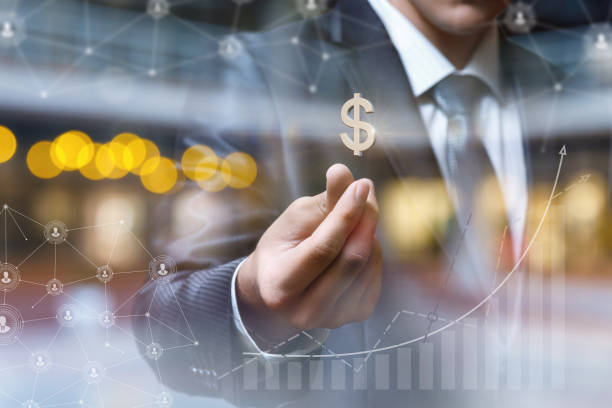 Businessman with dollar sign . Businessman with dollar sign on blurred background. capital budget pictures stock pictures, royalty-free photos & images