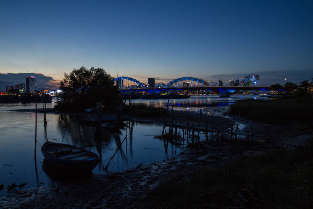 istock Skyline of da nang city by han river (Long exposure image). 1002312348