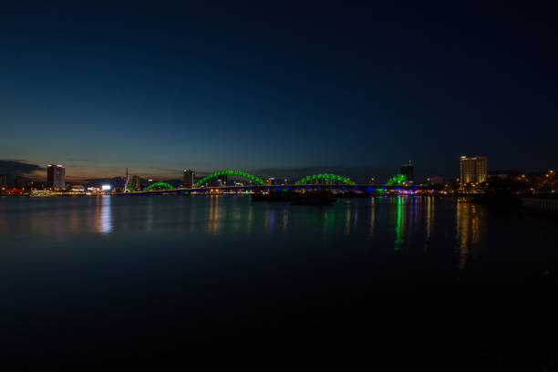 istock Skyline of da nang city by han river (Long exposure image). 1002312740