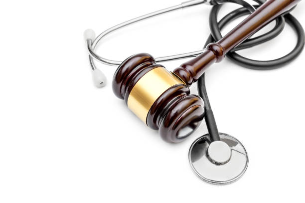 istock Gavel with stethoscope on white. Top view. Copy space. Medical law. 1002317526