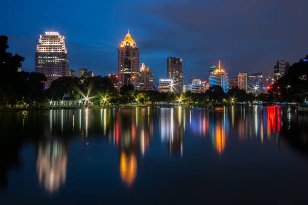 istock Reflection Of Illuminated Buildings In City At Night 1002318218