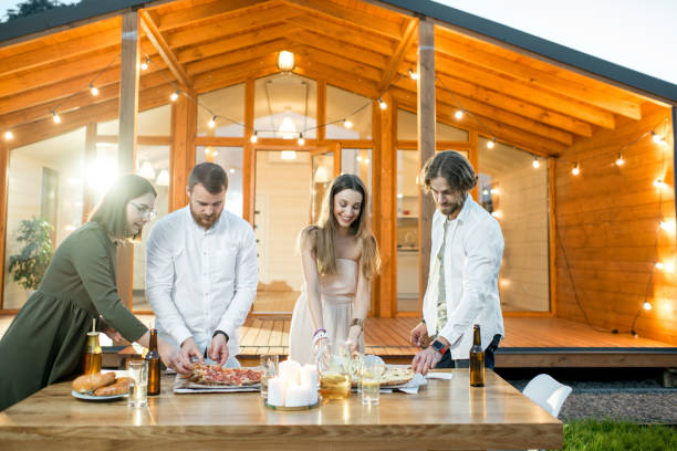 istock Friends dining near the house 1002334706