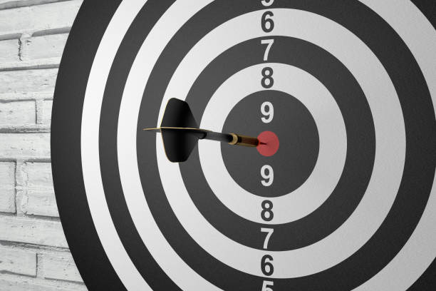 istock Dart in Bull's Eye on Brick Wall 1002335042