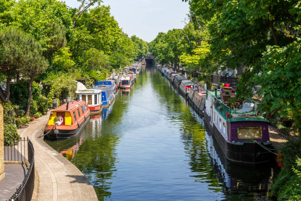 Narrow boats moored at Regent's Canal in Little Venice London Narrow boats moored at Regent's Canal in Little Venice London houseboat photos stock pictures, royalty-free photos & images