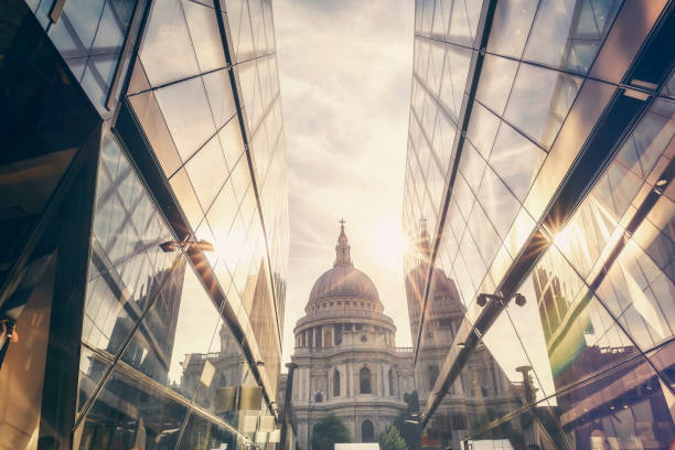 View of St Paul's Cathedral with the sun setting behind its dome in London