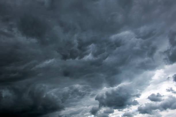 istock Stormy clouds have tightened the blue sky 1002339244