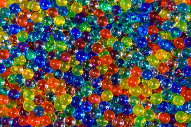 istock Texture of multicolored hydrogel balls for the background 1002342862