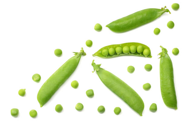 istock fresh green peas isolated on a white background. top view 1002358822