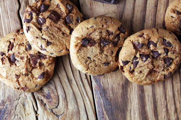 istock Chocolate cookies on table. Chocolate chip cookies shot with chocolate 1002373214
