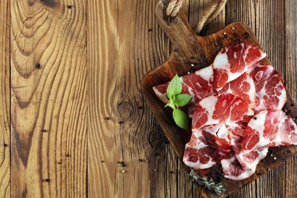 istock Italian sliced cured coppa with spices. Raw ham. Crudo or jamon 1002376182