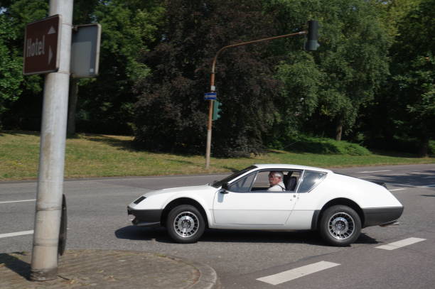 Trier, Germany, - July 14, 2018. Vintage sports car crossing the street on a warm summer day.