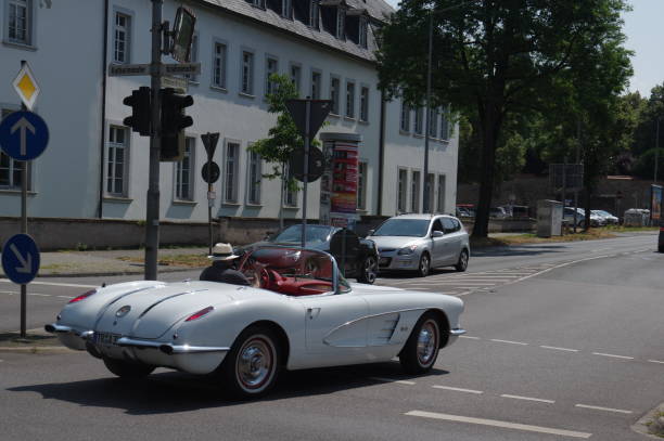 Vintage car Trier, Germany, - July 14, 2018. Vintage sports car crossing the street on a warm summer day. 1960 1969 photos stock pictures, royalty-free photos & images