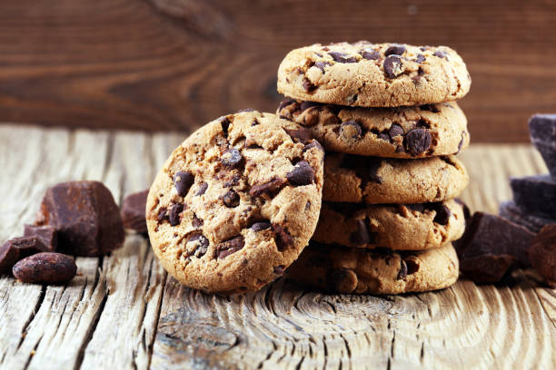 istock Chocolate cookies on table. Chocolate chip cookies shot with chocolate 1002377772