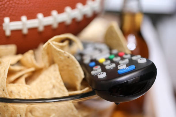 istock Watching the football game with snacks. 1002409118