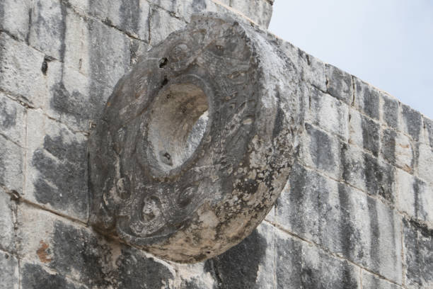 Ballgame stone hoop in the Great Ball Court Ballgame stone hoop in the Great Ball Court in ancient Mayan city of Chichen Itza. Chichen Itza was a large pre-Columbian city built by the Maya people, located in Tinúm Municipality, Yucatán State, Mexico. ulama stock pictures, royalty-free photos & images