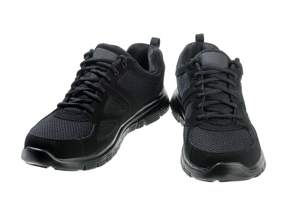 istock Black Sports Shoes Isolated 1002409692